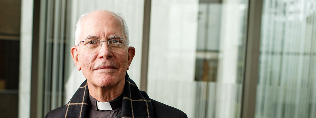 Headshot of the late Fr. Ely, SJ