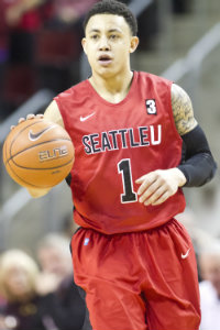 Isiah Umipig with the ball in a basketball game