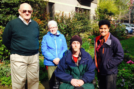 Keith Lewis in his new electric wheelchair with David Murphy, Margaret Moore, and Kiana Parker