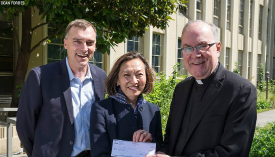 Carol Nelson of KeyBank (center) with Kent Koth of the Center for Community Engagement and President Stephen Sundborg, S.J.