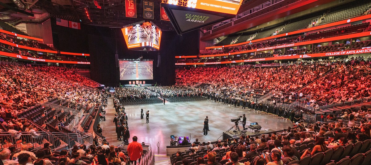 Wide shot inside commencement at Climate Pledge Arena