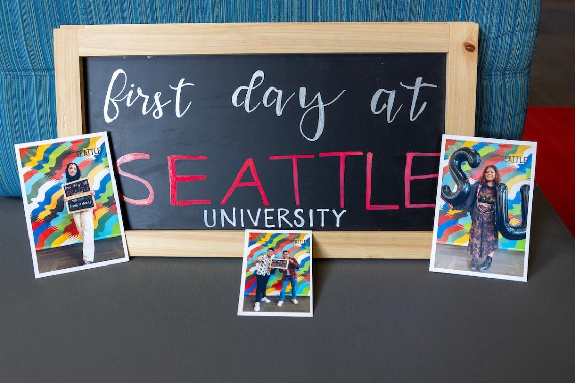 a picture of students in front of a first day of class sign