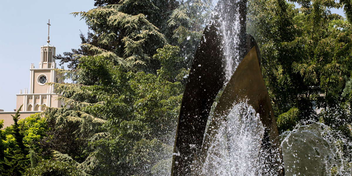 Seattle U fountain with Admin building in background