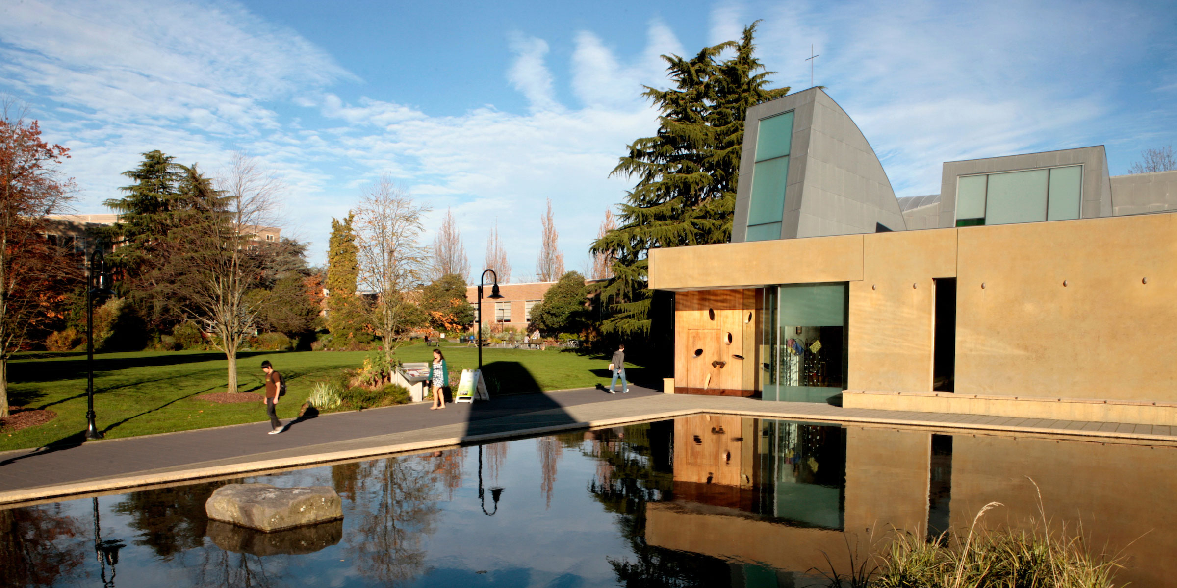 view of campus chapel, reflecting pool, and Union Green on a sunny fall morning