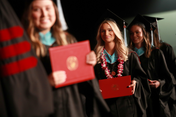 A group of graduate students at commencement