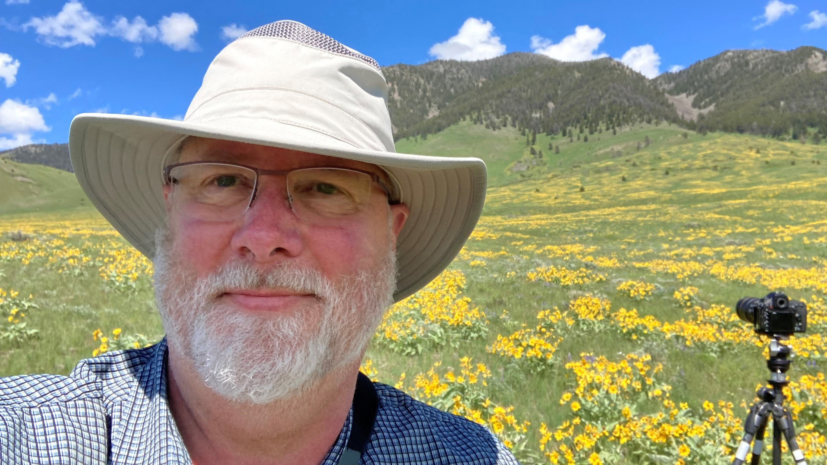 Jeff standing in field with bucket hat on