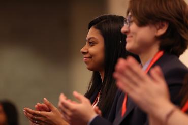 Two guests in audience at conference.