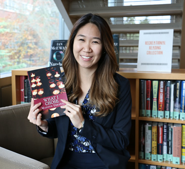 Madi Uekawa holding her book What I Chose