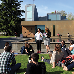 Class in front of reflecting pool