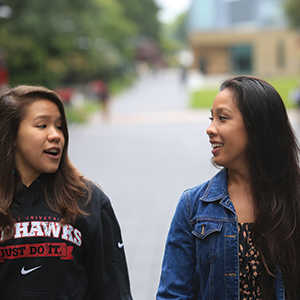 Sisters walking across campus