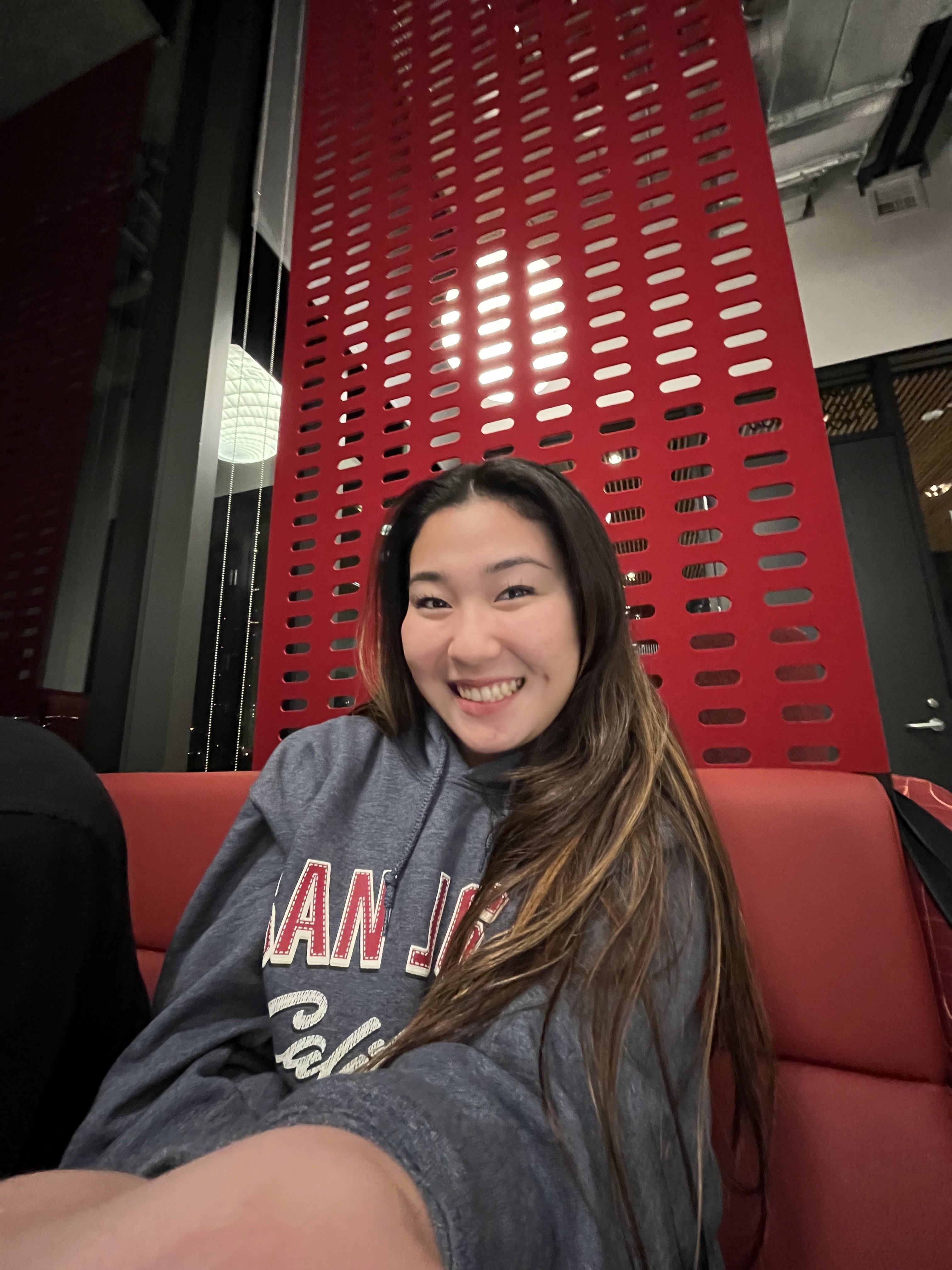 Student photographed on red seat