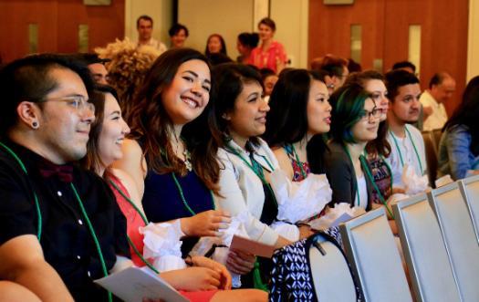 Students sitting at OMA graduation