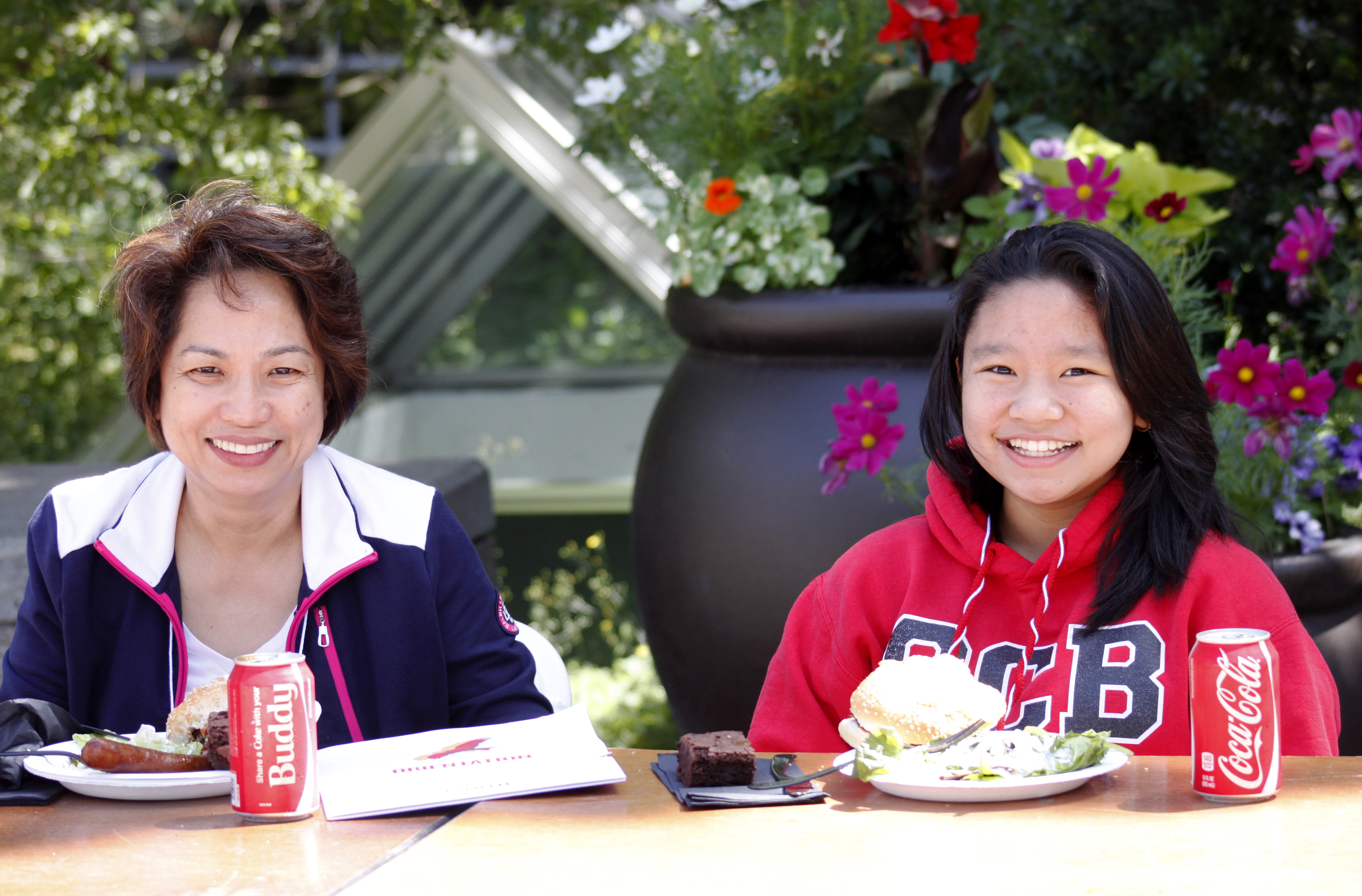 A student with her parent having lunch