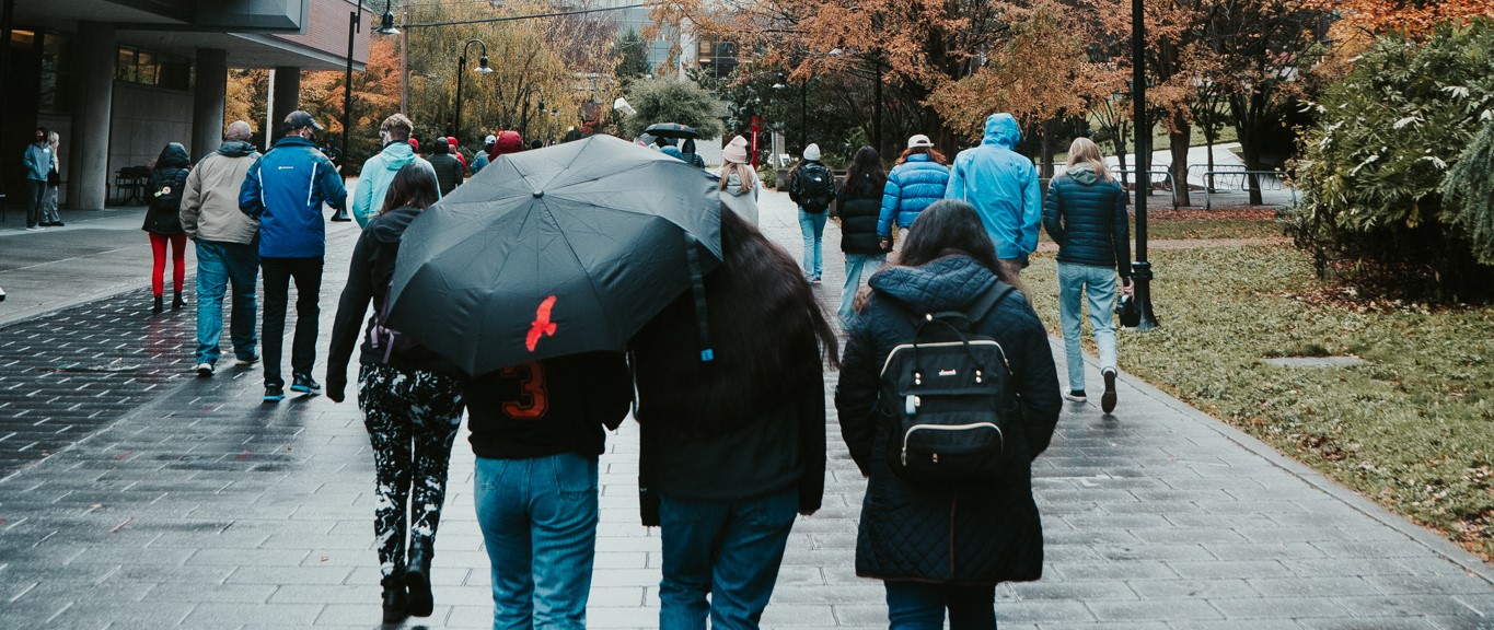 Fall Preview Day - walking on lower mall in rain