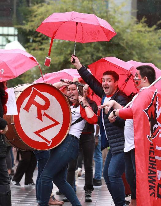 Students celebrating at the homecoming parade