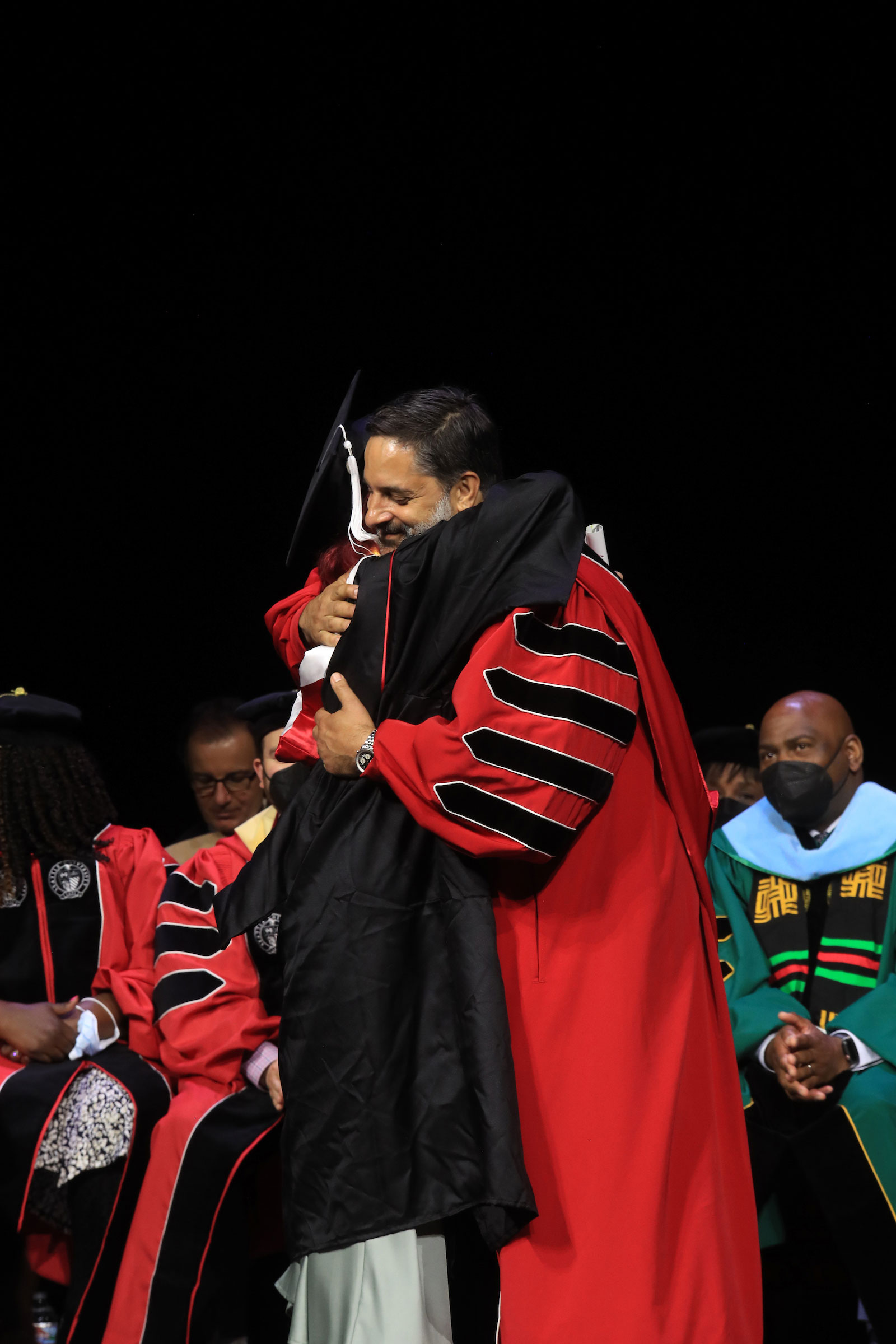 President Peñalver hugs a fellow commencement participant.