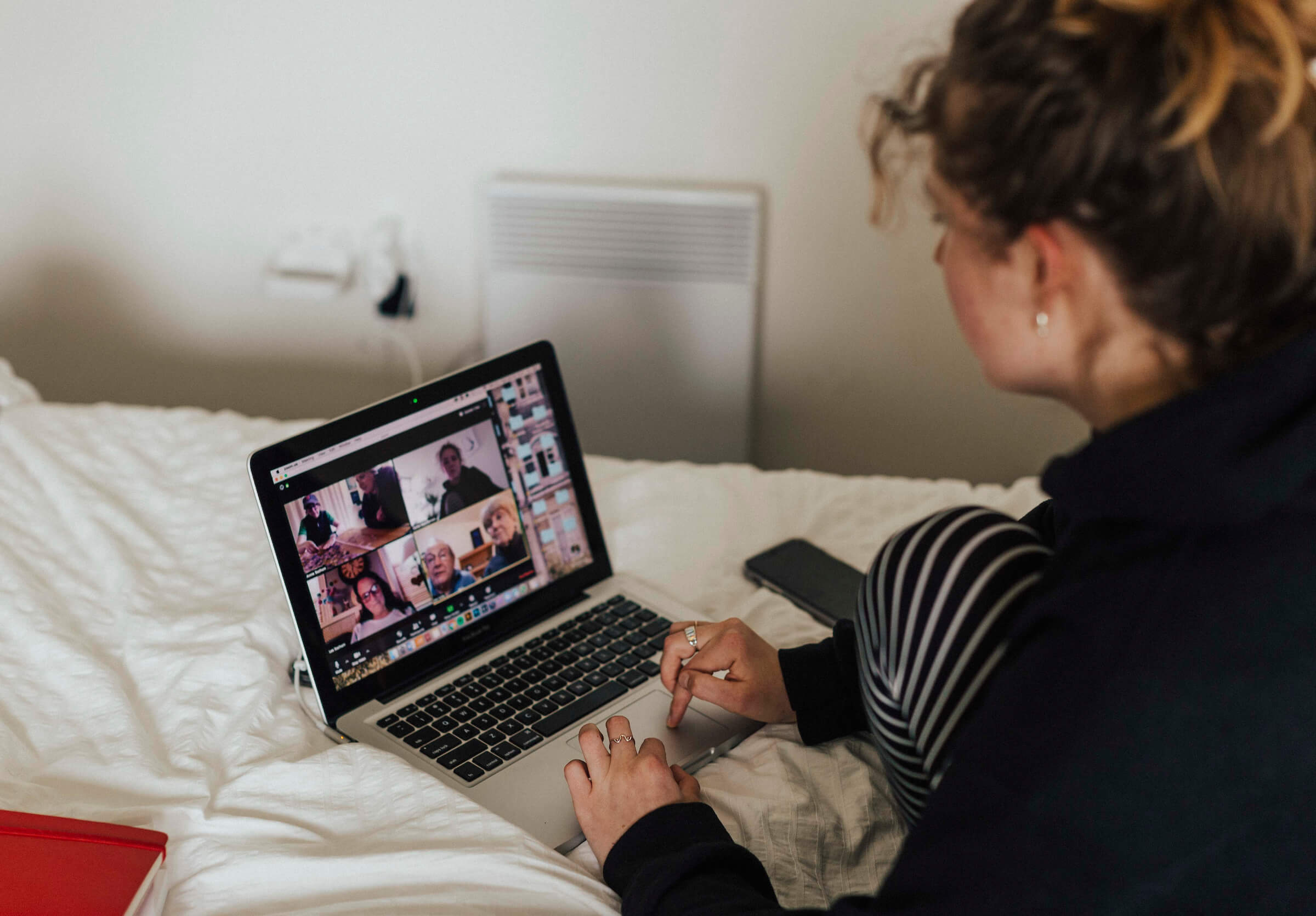 Hallie video chats with extended family on a laptop