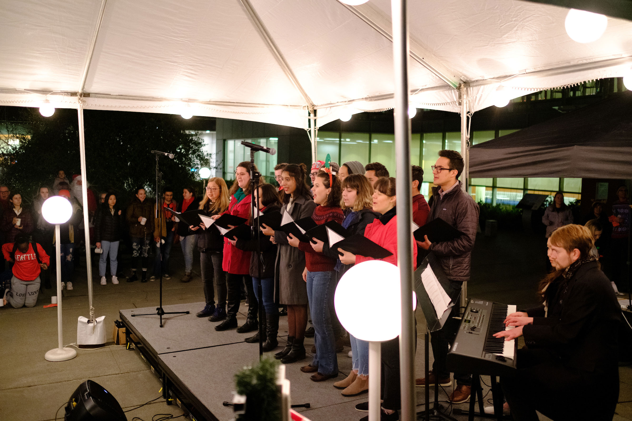 members of the choir sing on stage