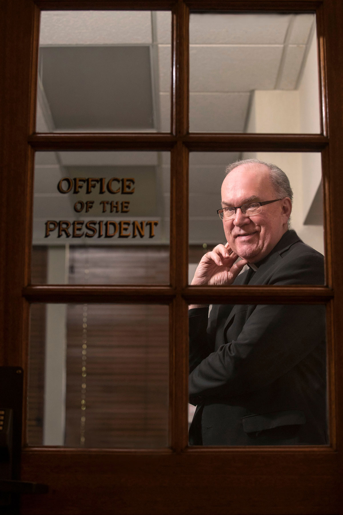 Father Stephen Sundborg stands inside that same office door, 20 years later