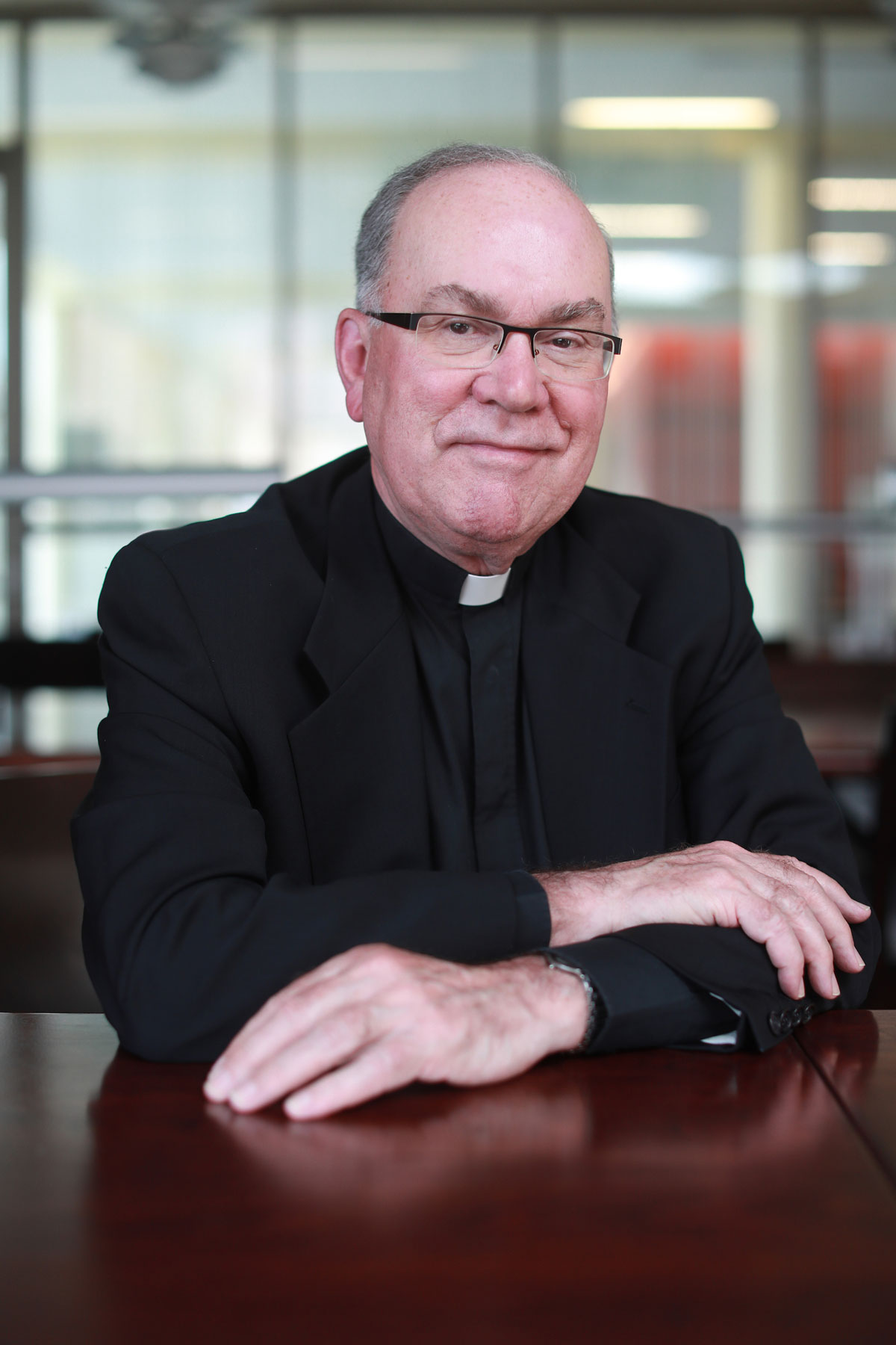 A portrait of Father Steve, smiling