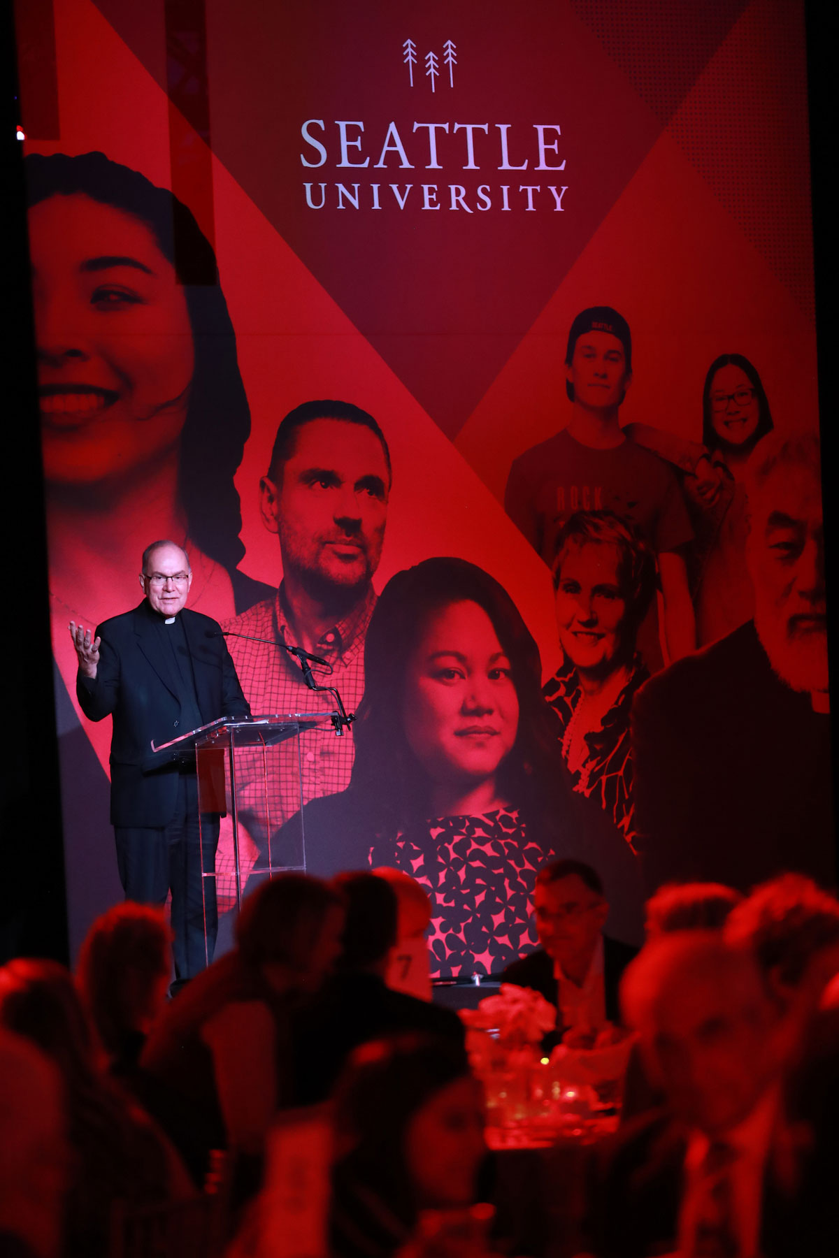 President Sundborg speaks on stage, with members of SU community in the audience, at campaign kick-off event.