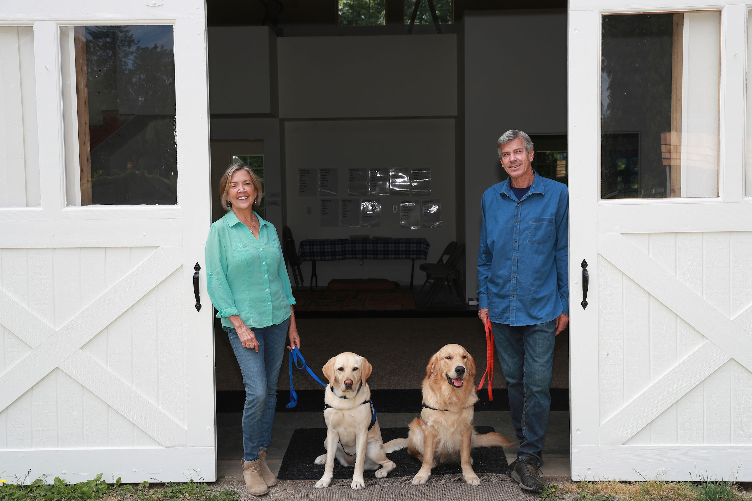 Maureen in front of barn doors