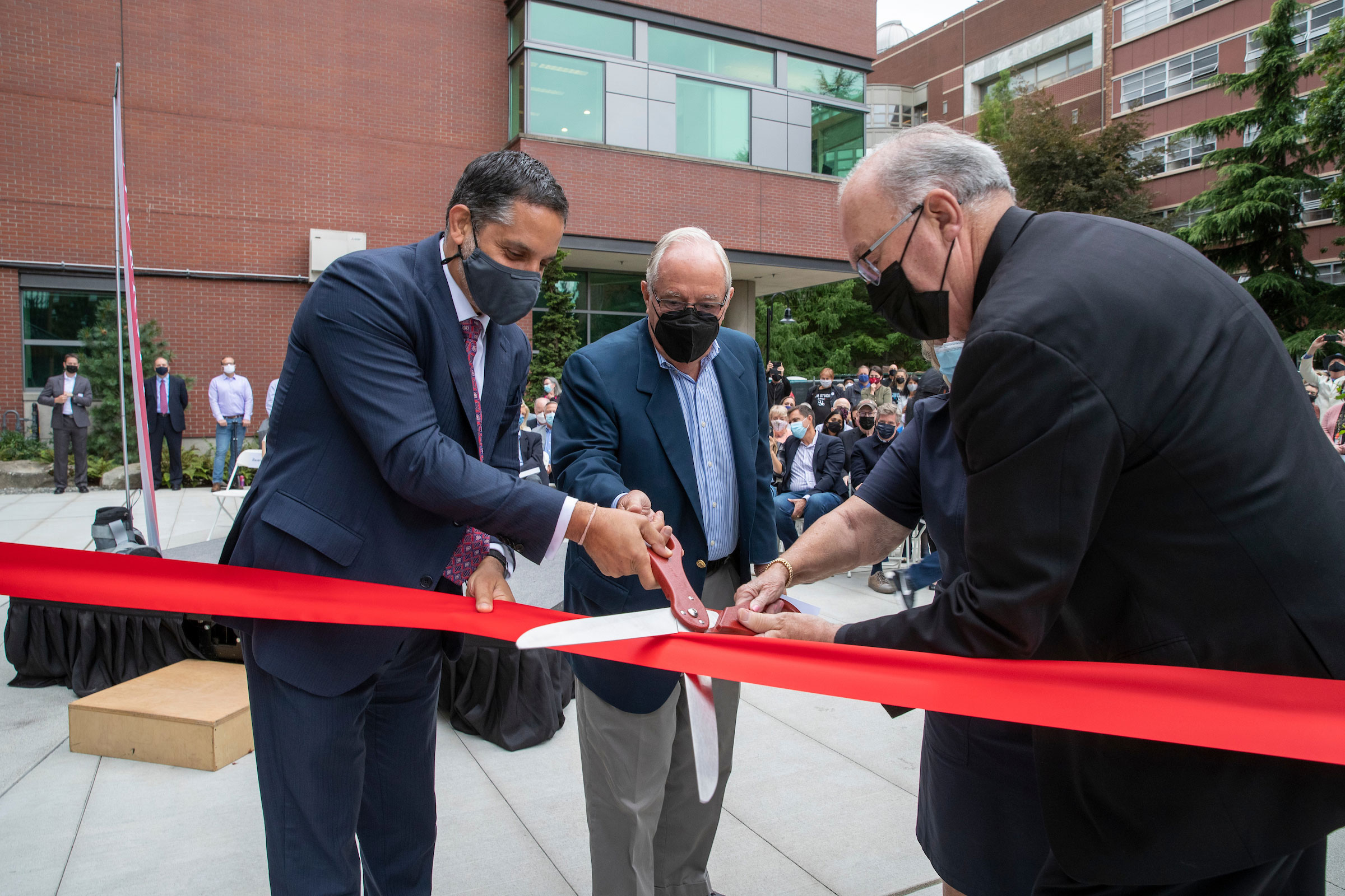 President Peñalver joins Jim Sinegal and President Emeritus Sundborg at the ribbon cutting and dedication ceremony