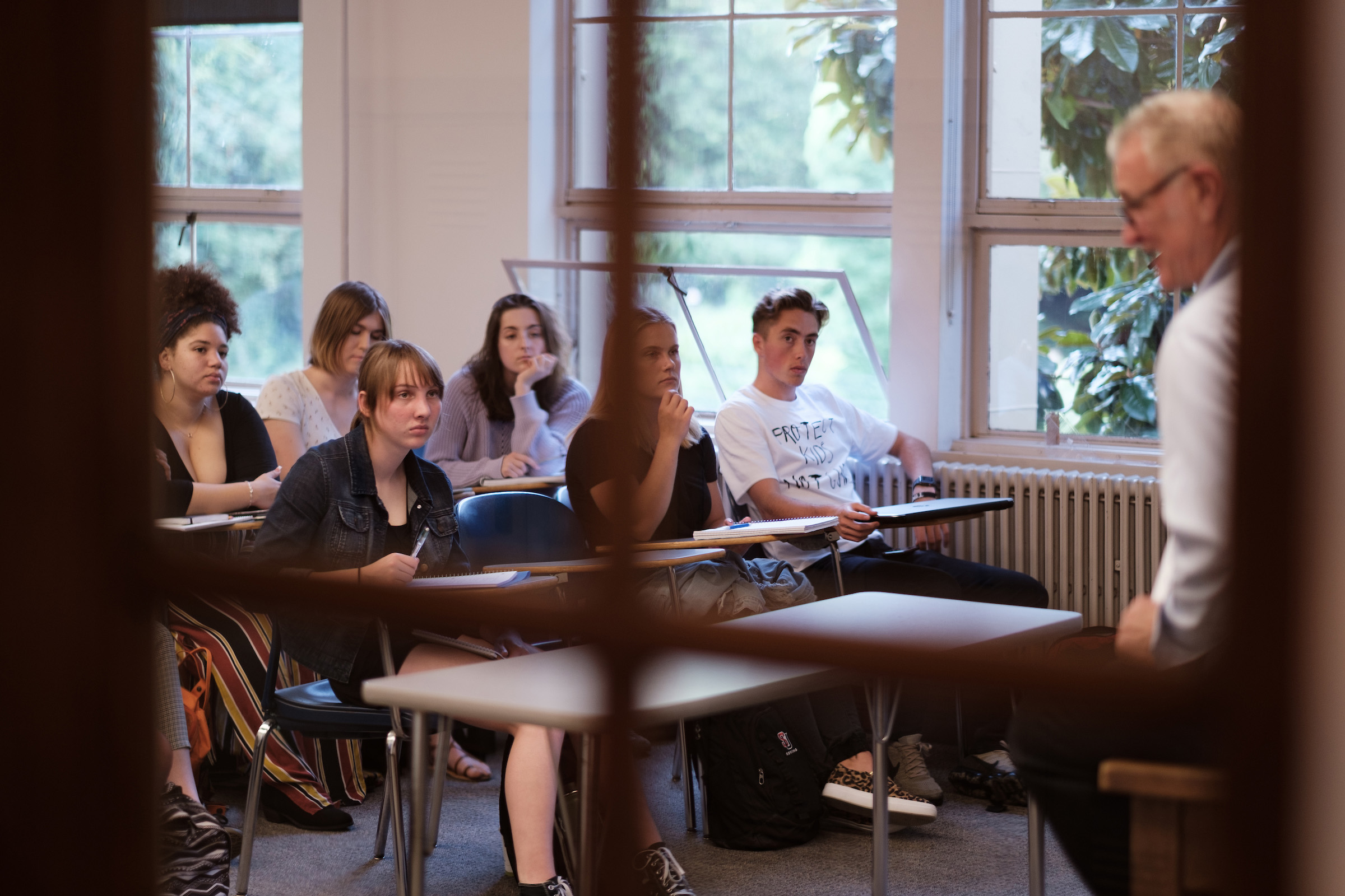 Students and professor in classroom.