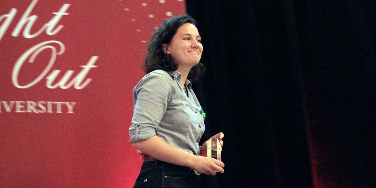 a student accepting an award at Red Night Out