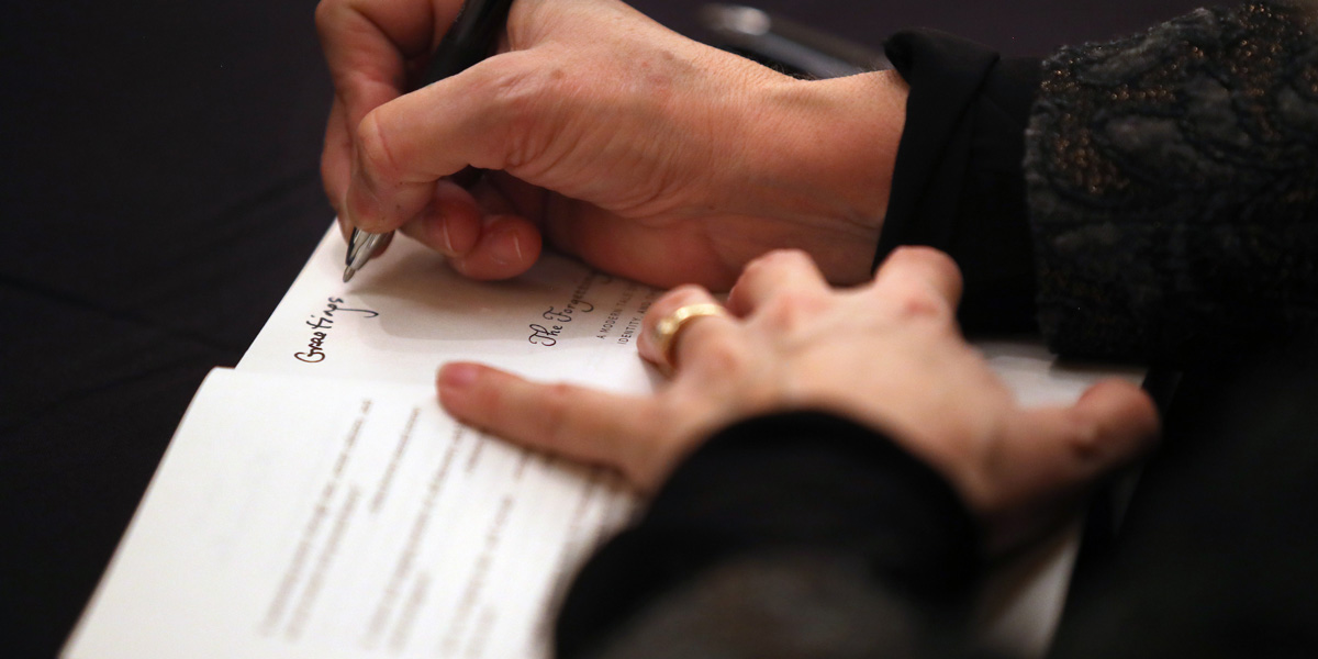 an author signing a book