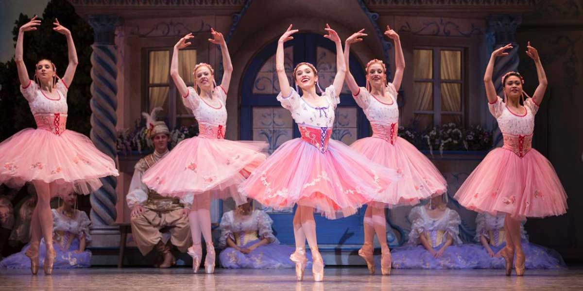 PNB soloist Leta Biasucci (center) with company dancers in Coppélia, choreographed by Alexandra Danilova and George Balanchine © The George Balanchine Trust. Photo © Angela Sterling.