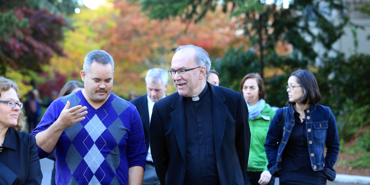 Fr. Steve Sundborg speaking with community members