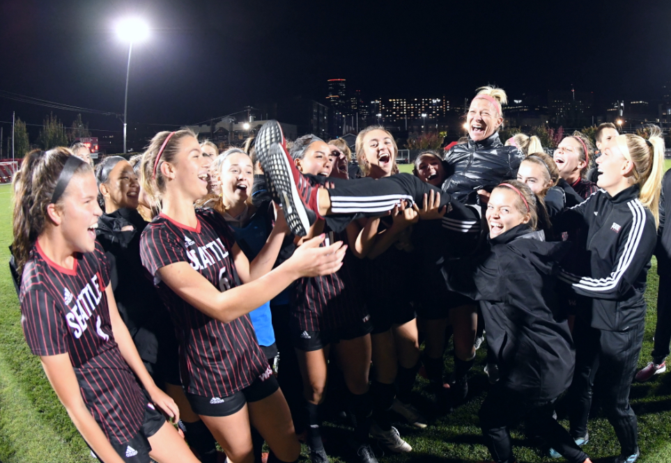 Women's soccer team celebrates Coach Julie Woodward's 300th win.