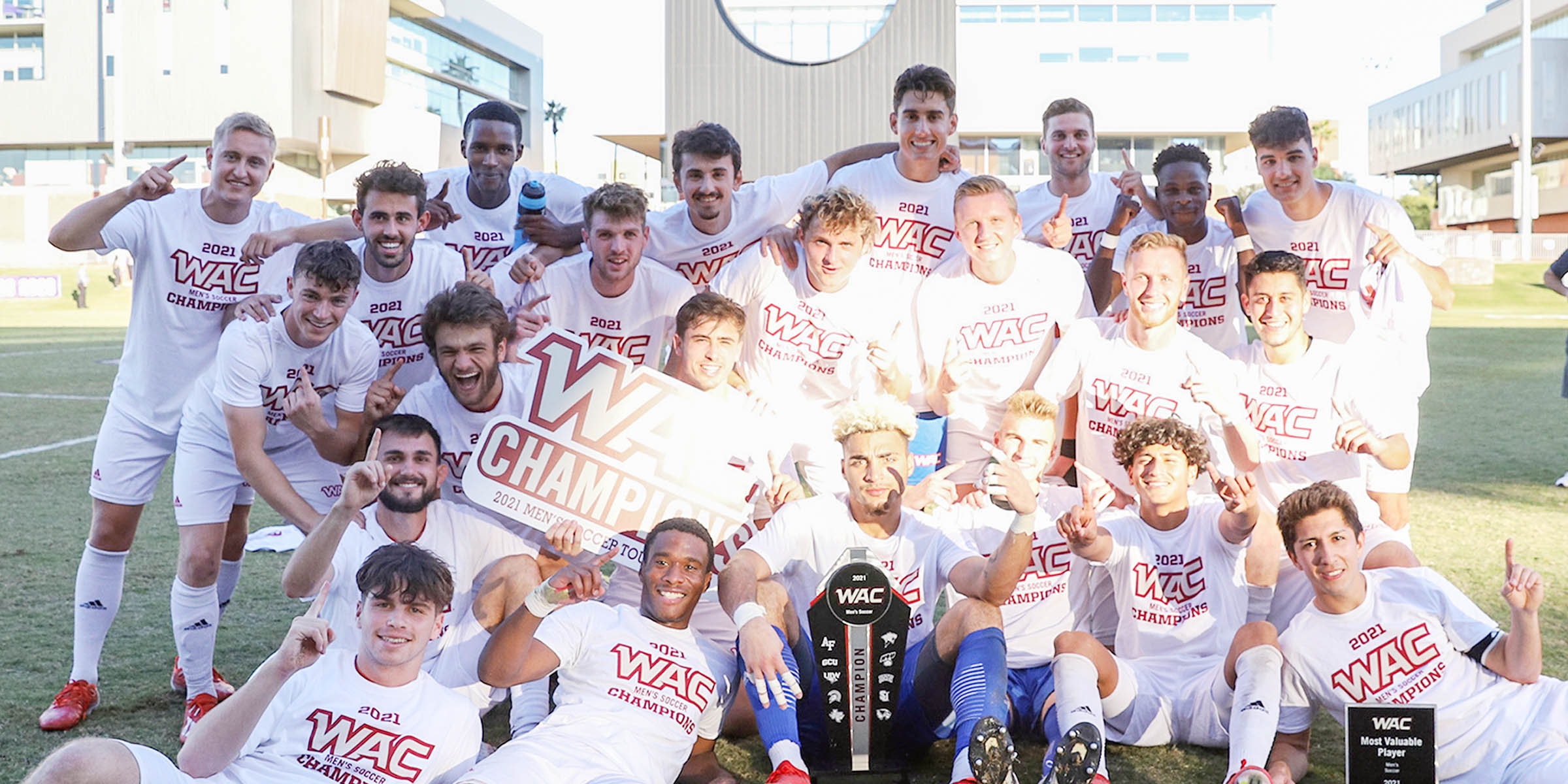 Photo of Seattle University's Men's Soccer Team posing on field together.