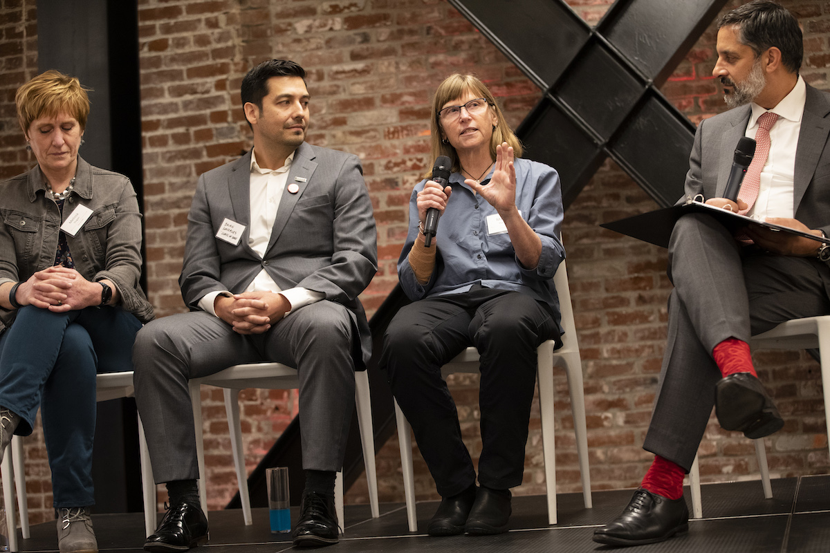 Eduardo leads a panel discussion in Portland, Ore.