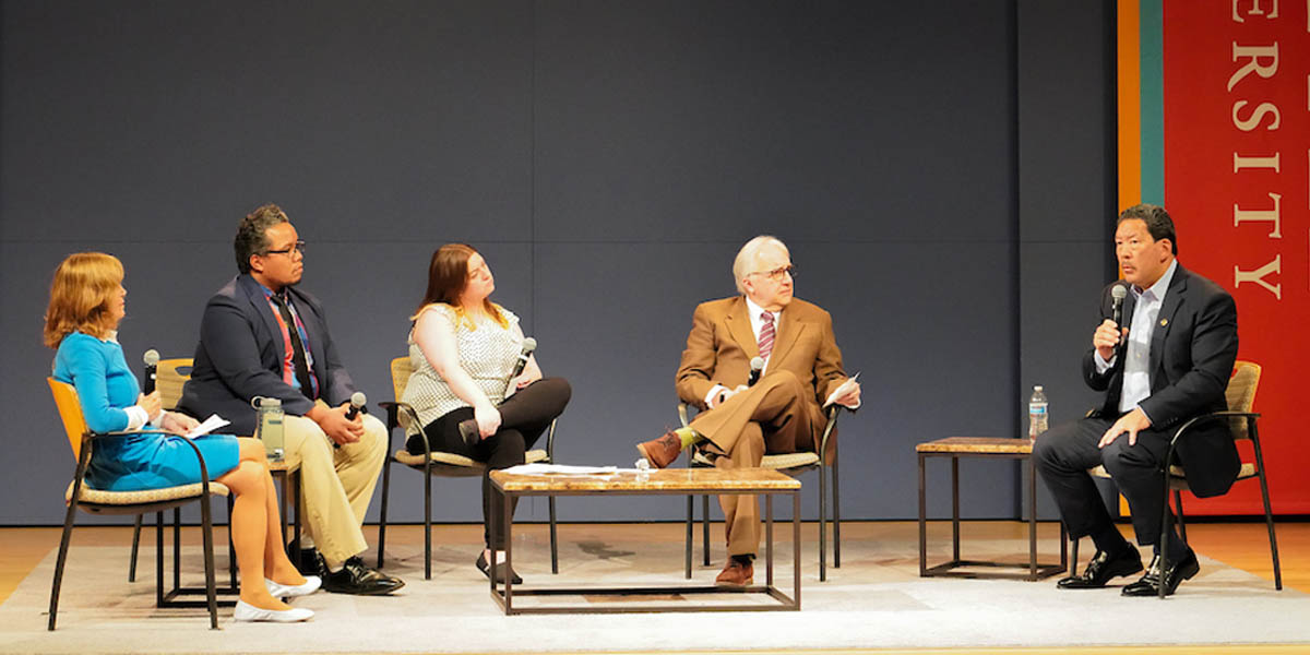 Photo of panelists on stage with Mayor Bruce Harrell during speaking event.