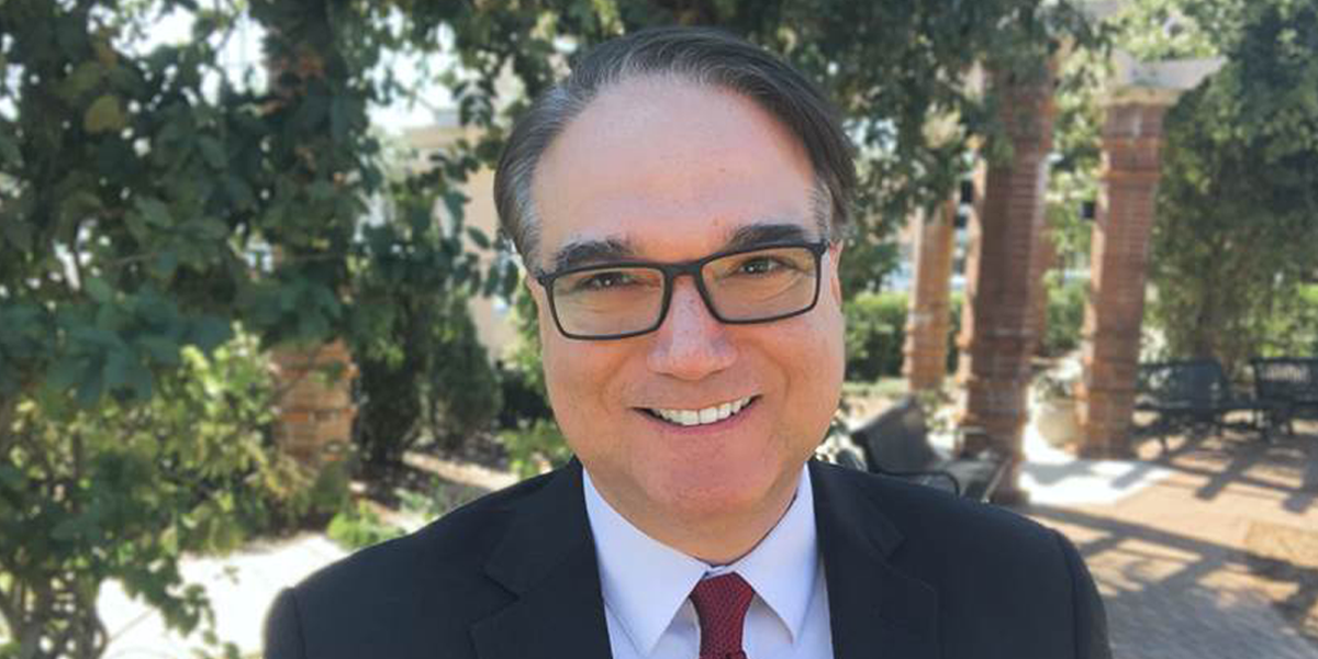 Headshot of Anthony E. Varona. Text reads Anthony E. Varona Named Dean of School of Law. Seattle University logo at bottom.