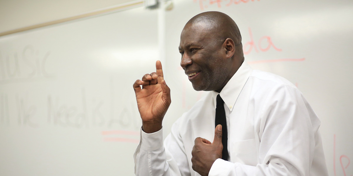 Edward Reed, smiling while teaching a class