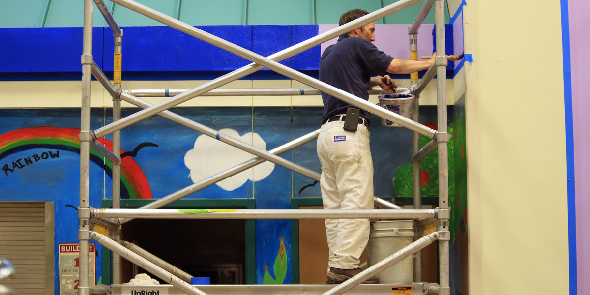 SU Facilities Team helping to repaint the interior of Bailey Gatzert Elementary School