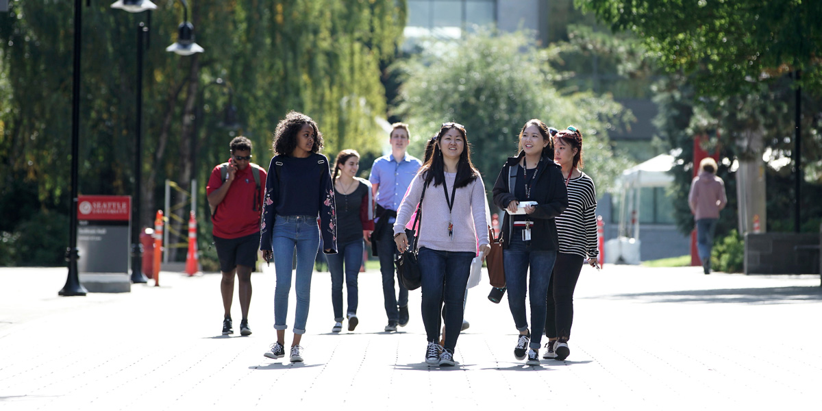 Students walking through campus on a sunny day