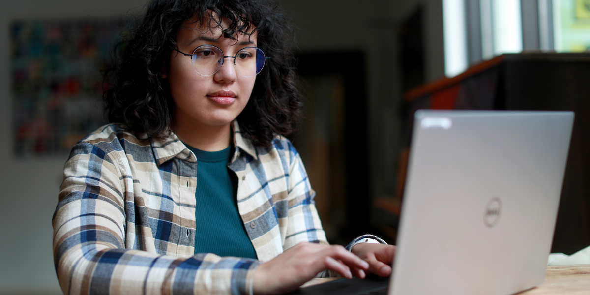 a student working on their laptop