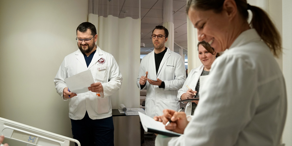 Four nursing students in a nursing lab