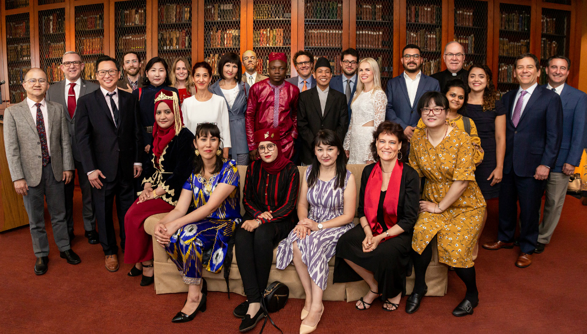 The 18 scholars posed for a group photo.