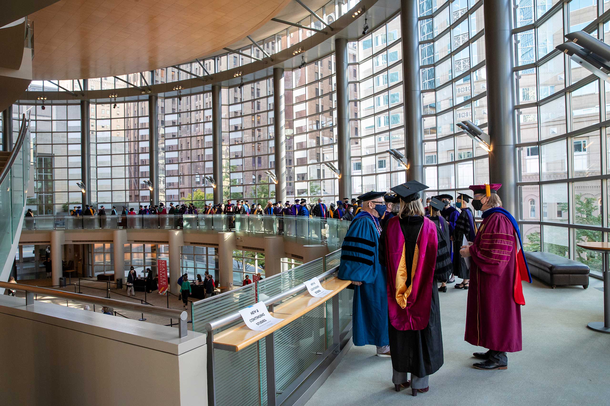 Faculty and Staff wait inside Benaroya Hall