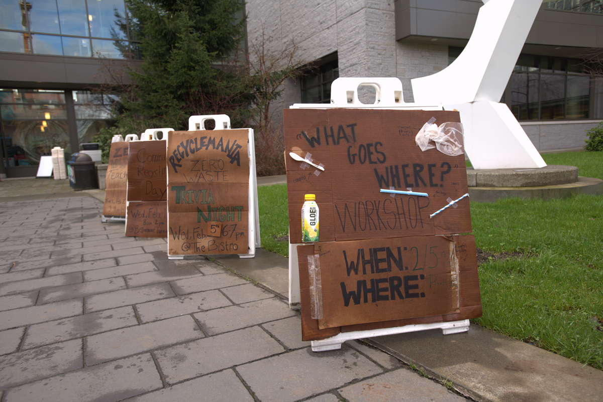   Recyclemania sandwich board signs lining the library plaza