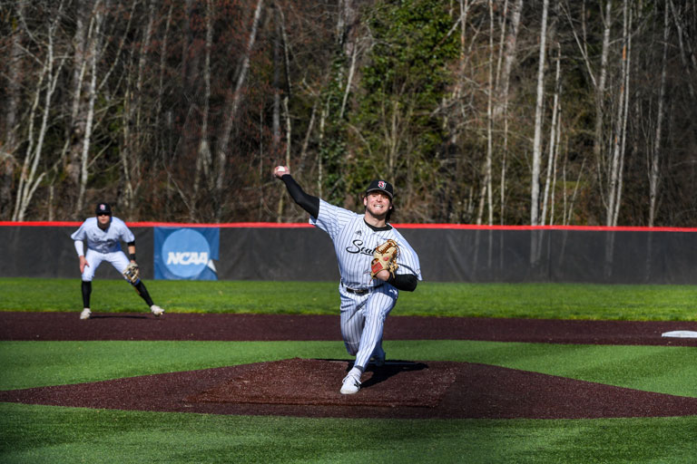   Brady Liddle, ’24 releases a pitch at Bannerwood Park in Bellevue.