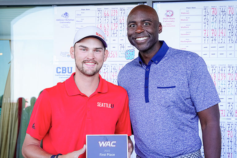   Nathan Cogswell, ’22 poses with WAC Commissioner Brian Thornton at the WAC Championship.