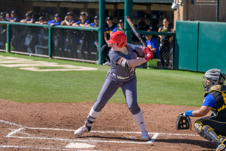   Carley Nance, ‘21, at home plate, ready to swing.