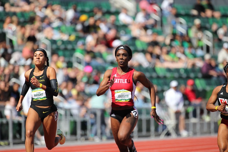   Tricht Jocelyn, ‘22, mid-stride, running on the track.